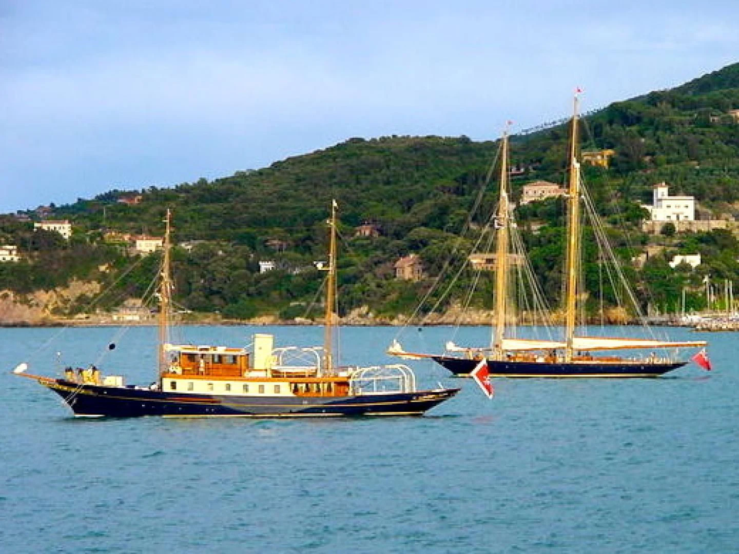 a couple of boats sit in the water aboard ATLANTIDE Yacht for Sale