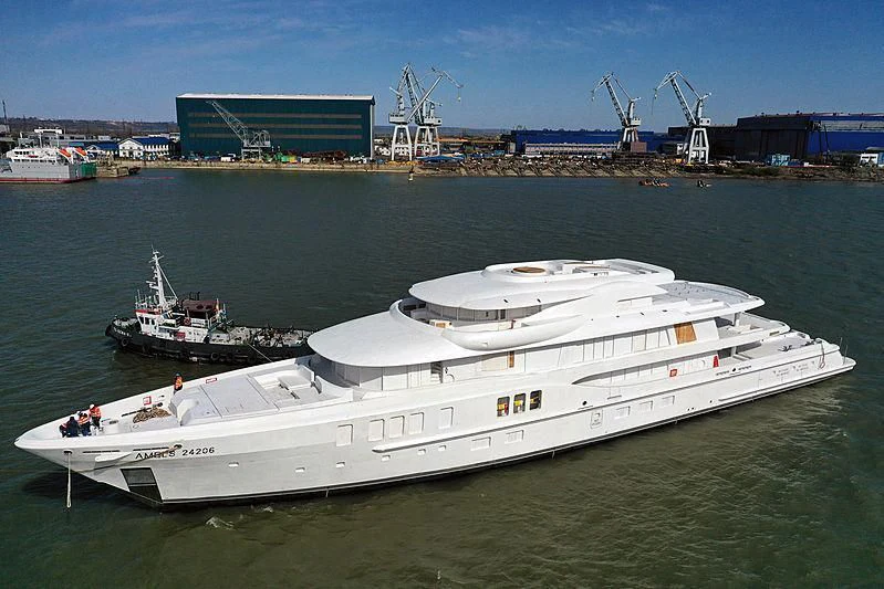 a large white boat in a harbor aboard AVANTI Yacht for Sale