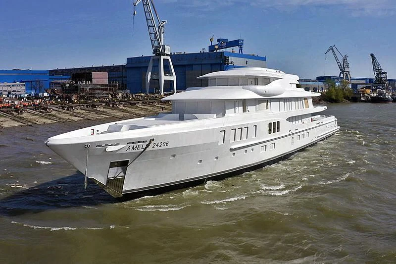 a large white boat in a harbor aboard AVANTI Yacht for Sale