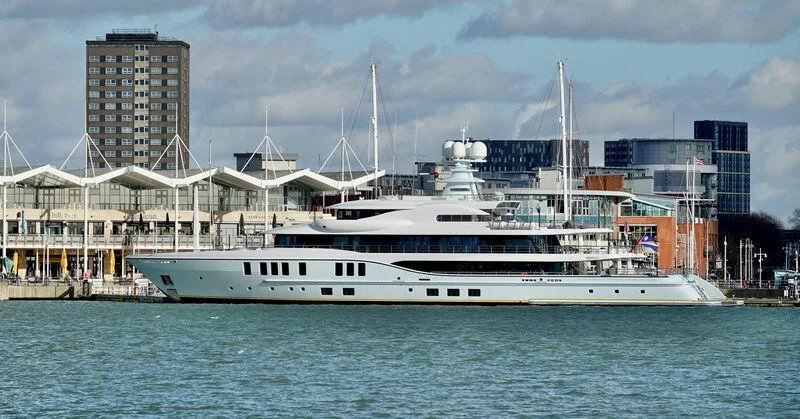 a large white boat in a harbor aboard AVANTI Yacht for Sale