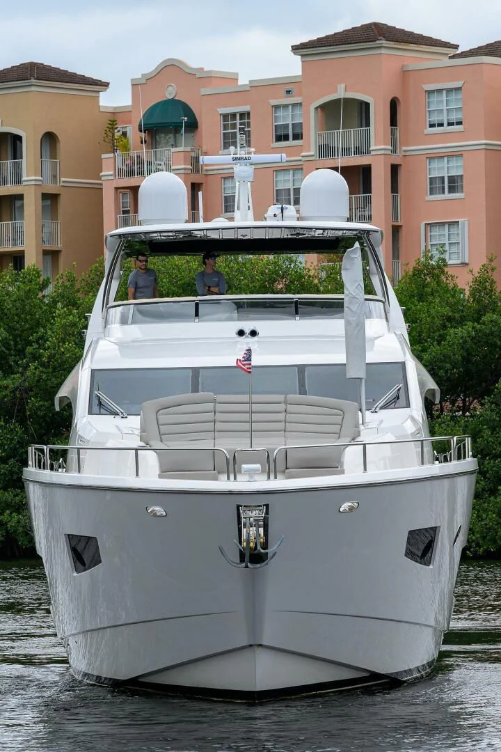 a white boat with a group of people on it aboard SKYCHASER Yacht for Sale