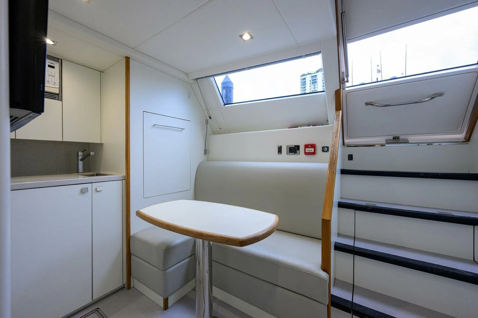 a small kitchen with a table aboard SKYCHASER Yacht for Sale