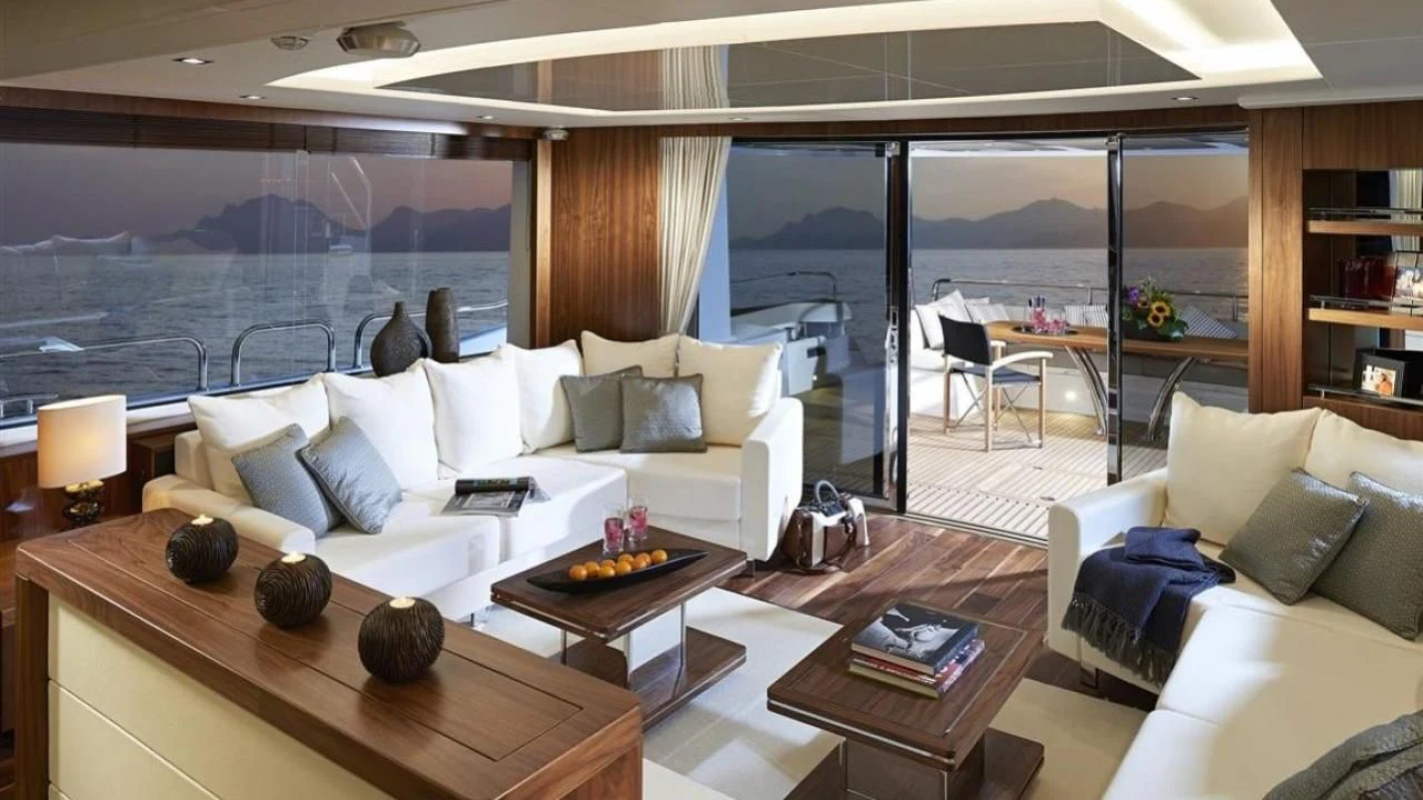 a living room with a large window aboard SKYCHASER Yacht for Sale