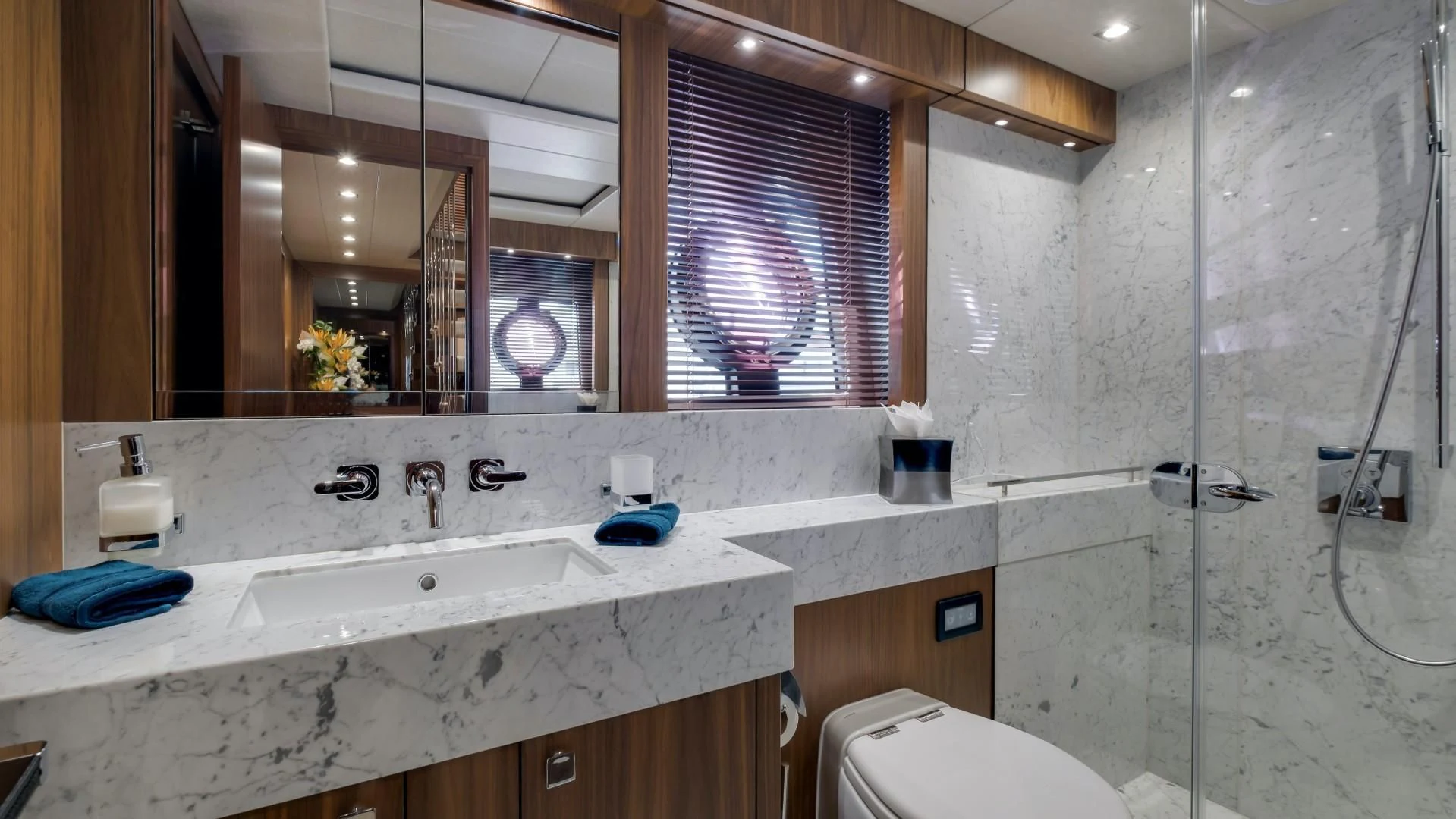 a bathroom with a large mirror aboard SKYCHASER Yacht for Sale