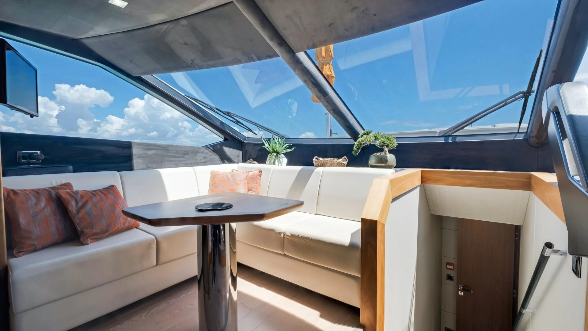 a room with a couch and a table aboard SKYCHASER Yacht for Sale