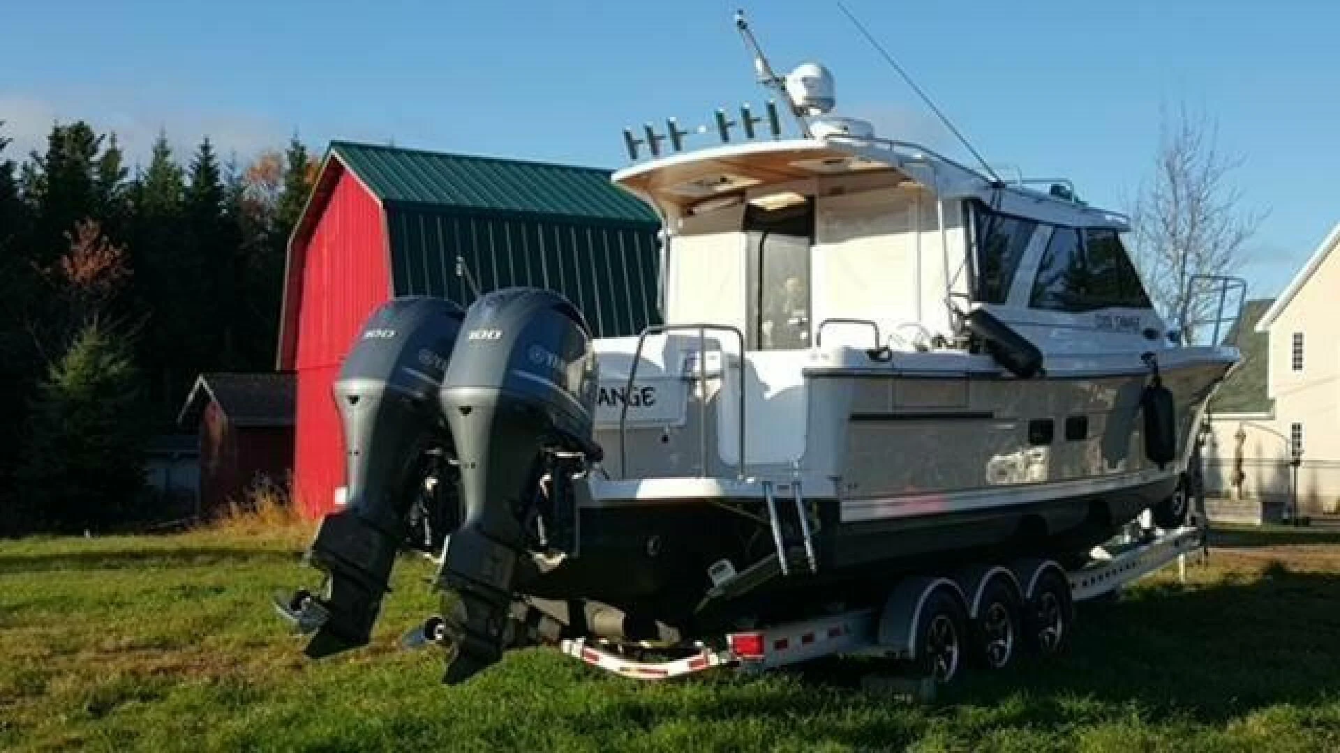 a military vehicle parked on grass aboard SKYCHASER Yacht for Sale