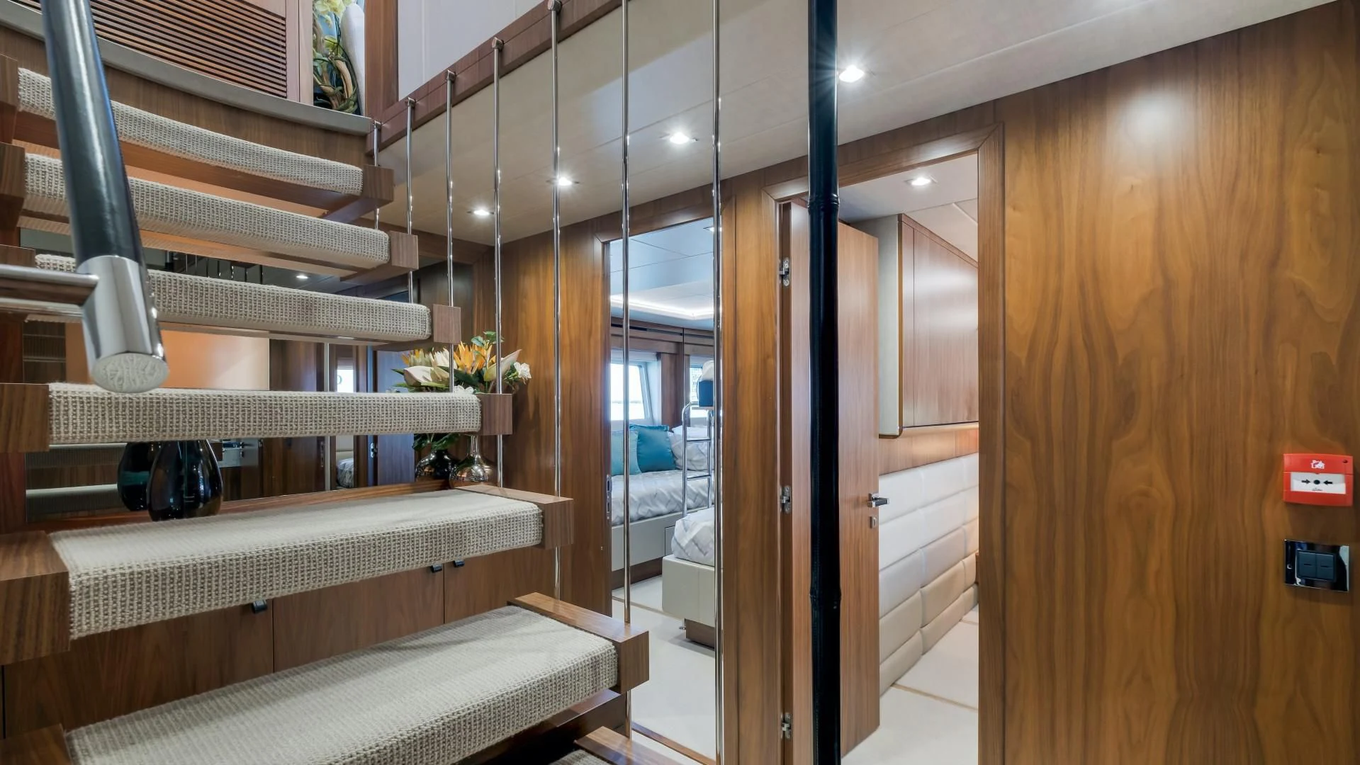 a room with a glass door and a white shelf with white objects on it aboard SKYCHASER Yacht for Sale