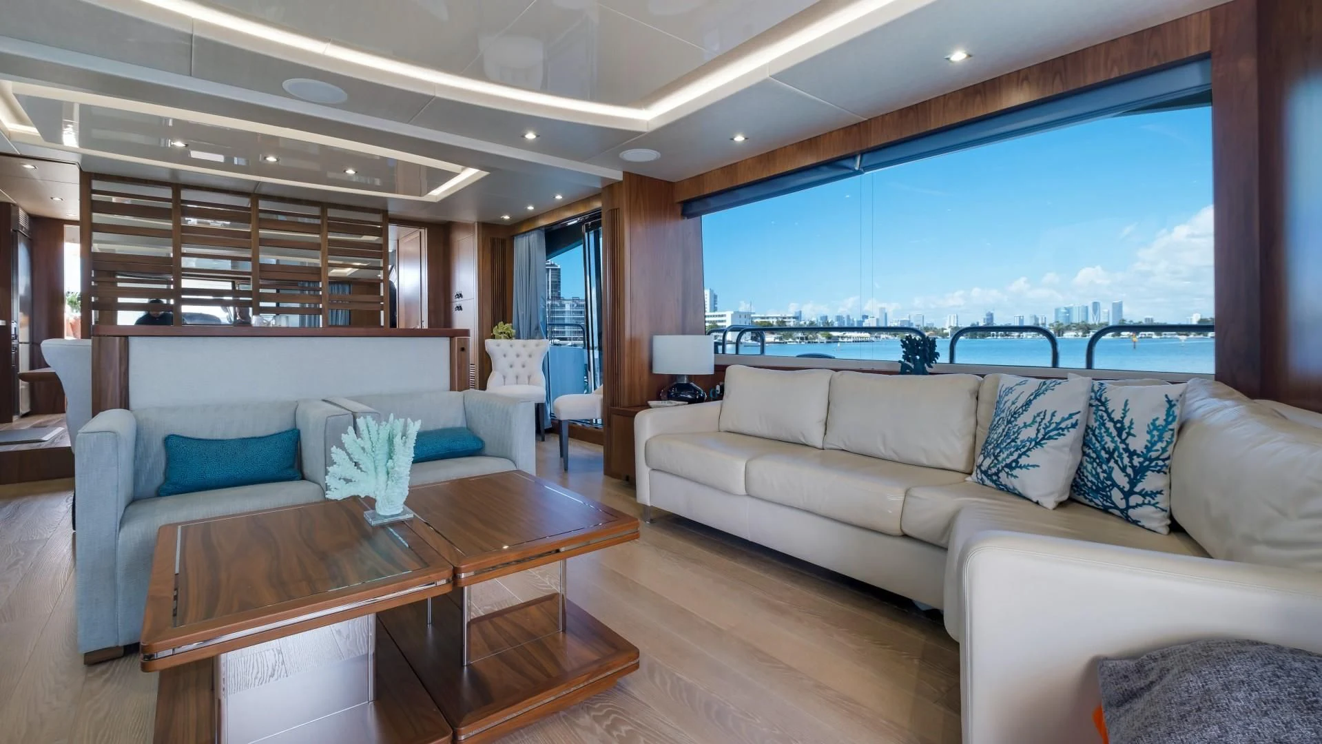 a living room with a large window aboard SKYCHASER Yacht for Sale