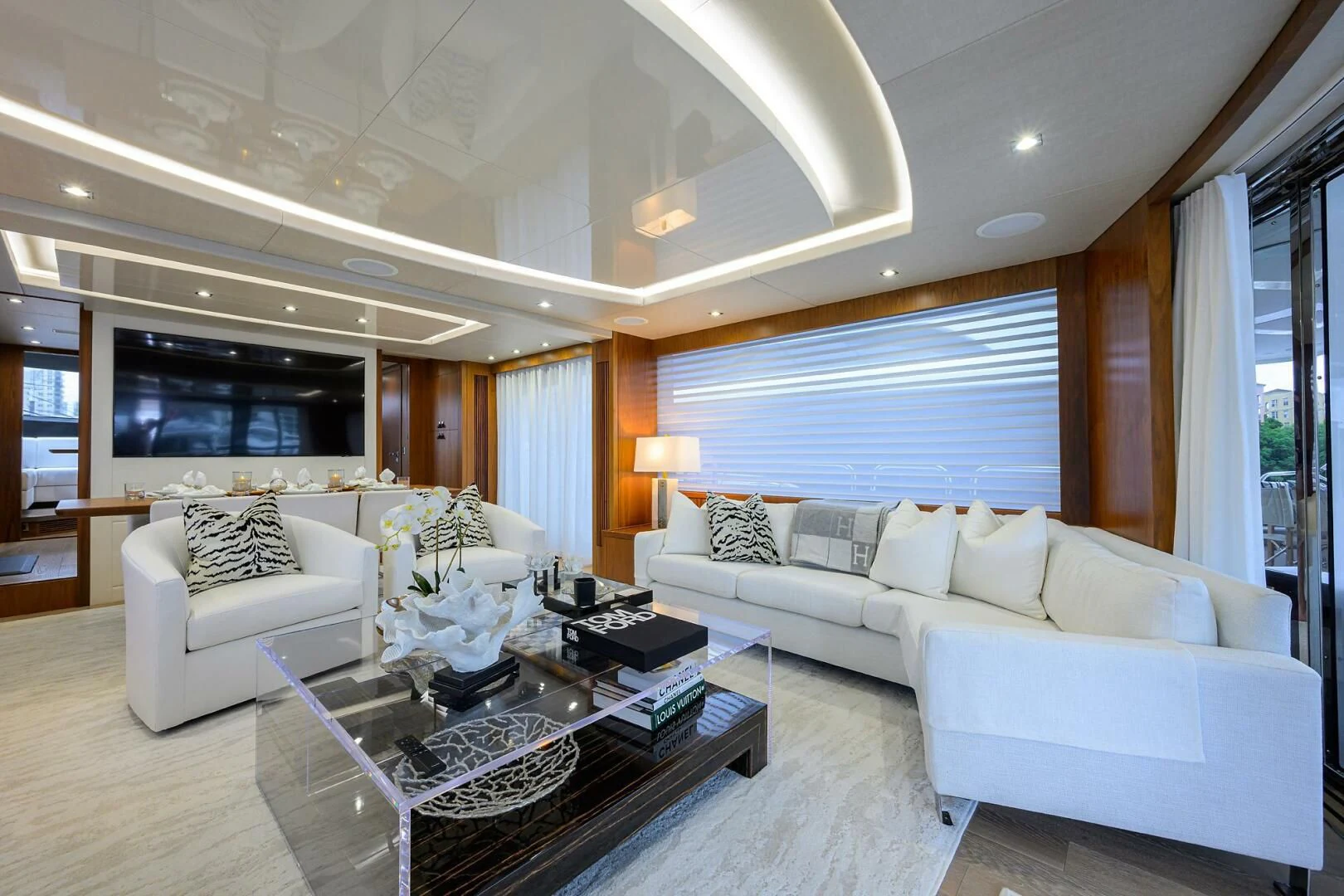a living room with a large window aboard SKYCHASER Yacht for Sale