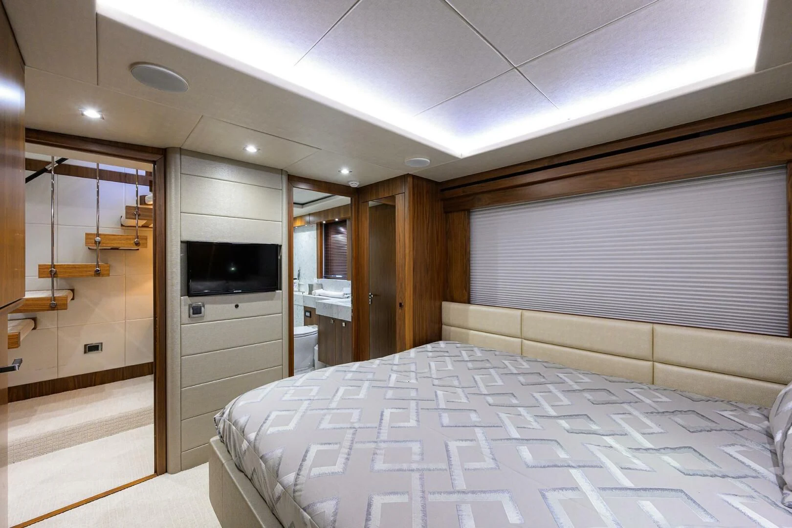 a bedroom with a bed aboard SKYCHASER Yacht for Sale