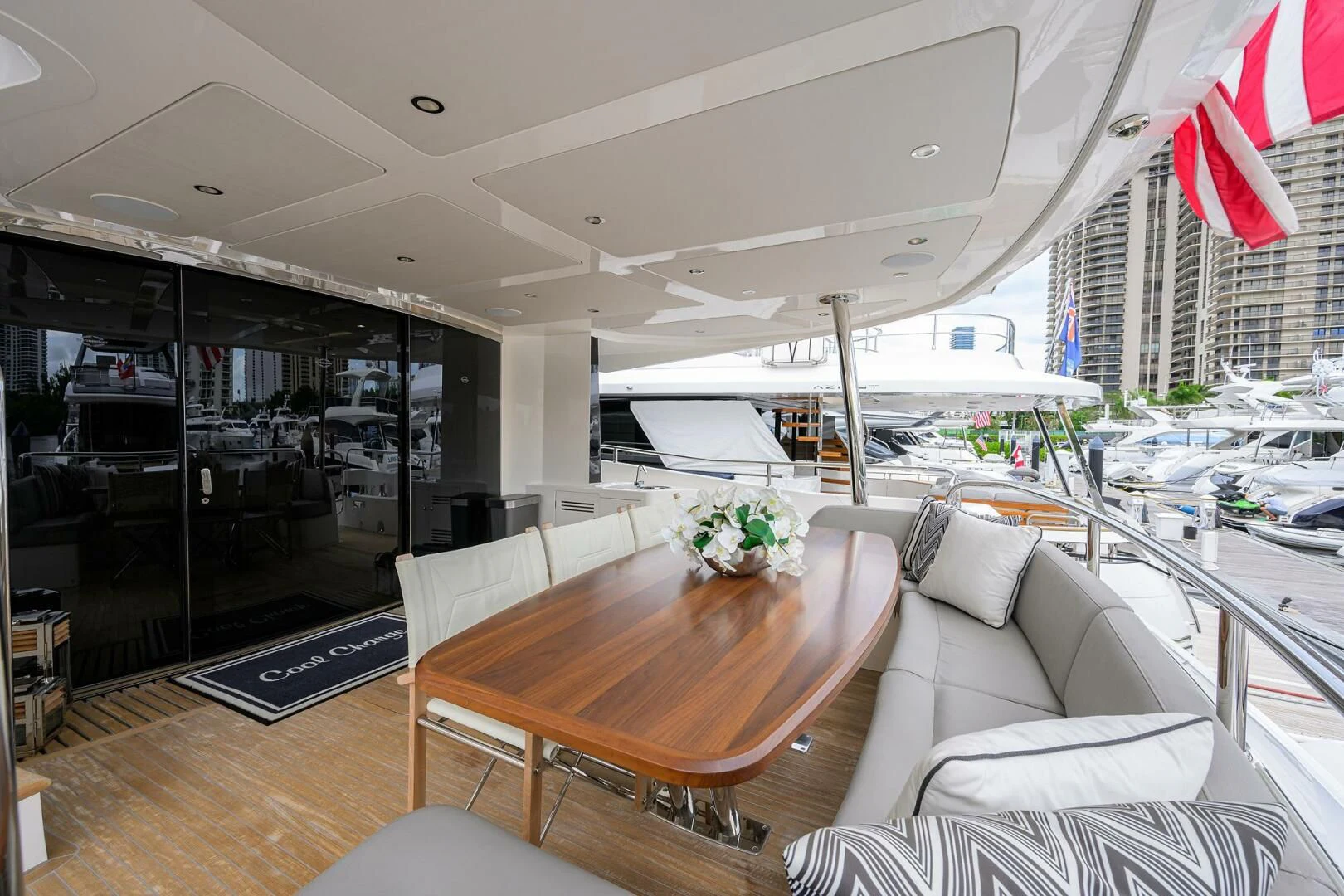 a room with a table and chairs aboard SKYCHASER Yacht for Sale