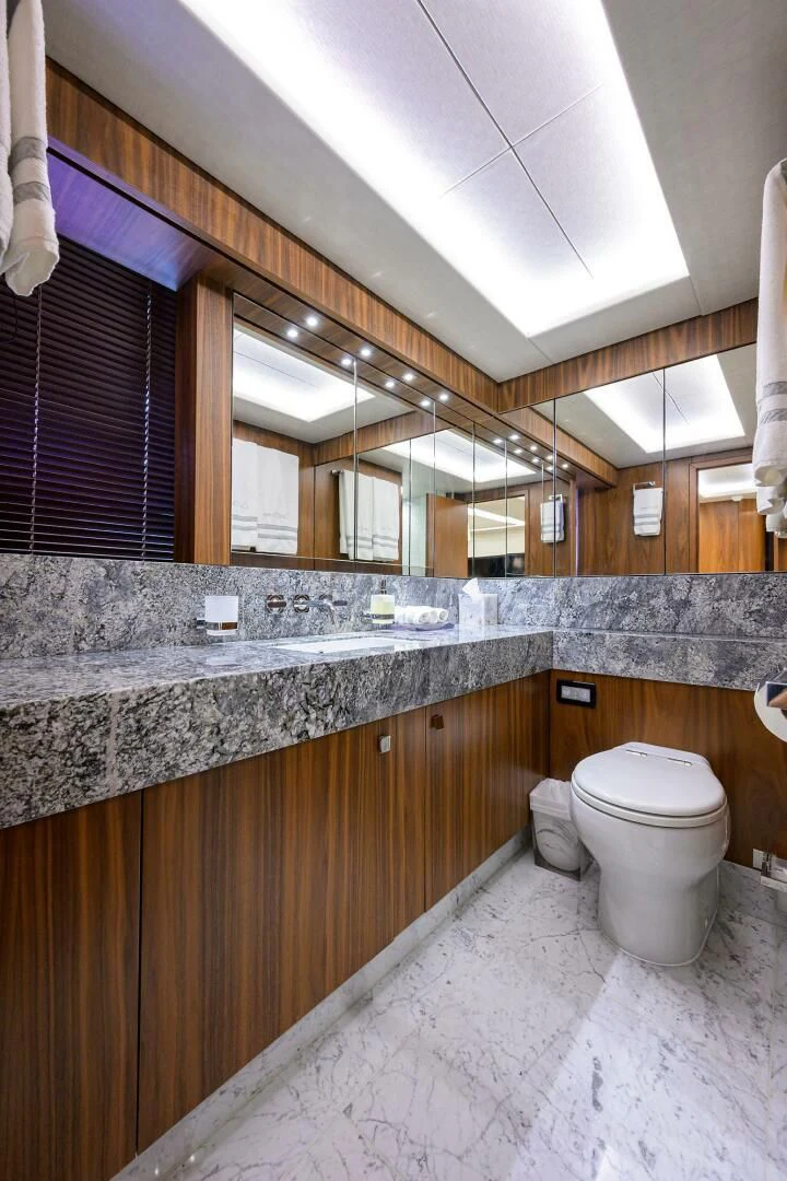 a bathroom with a large mirror aboard SKYCHASER Yacht for Sale