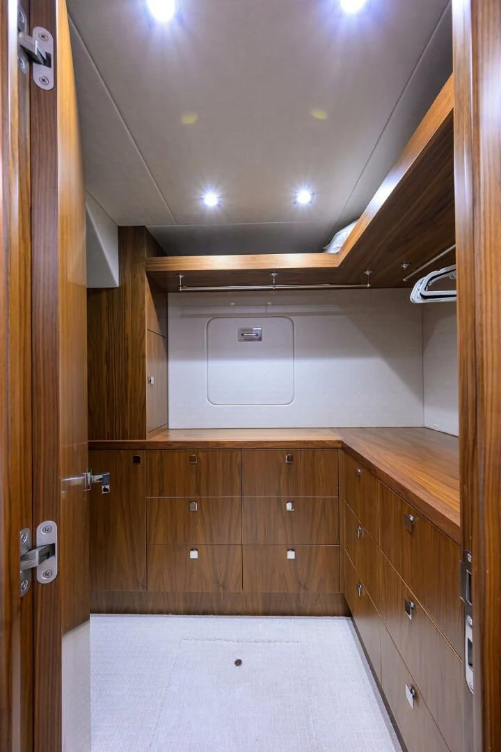 a kitchen with wooden cabinets aboard SKYCHASER Yacht for Sale