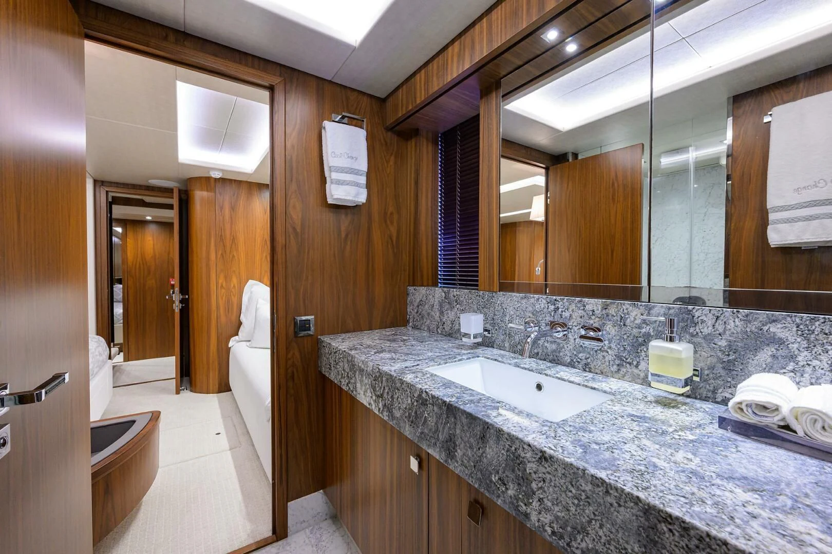 a bathroom with a large marble countertop aboard SKYCHASER Yacht for Sale