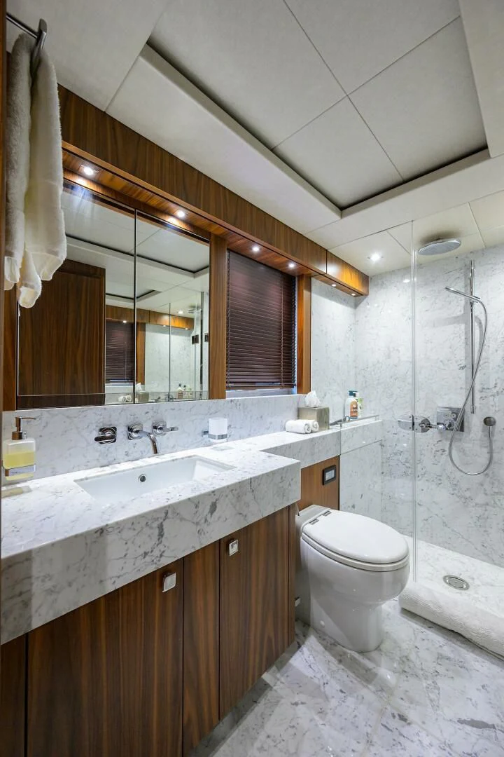 a bathroom with a sink and a toilet aboard SKYCHASER Yacht for Sale