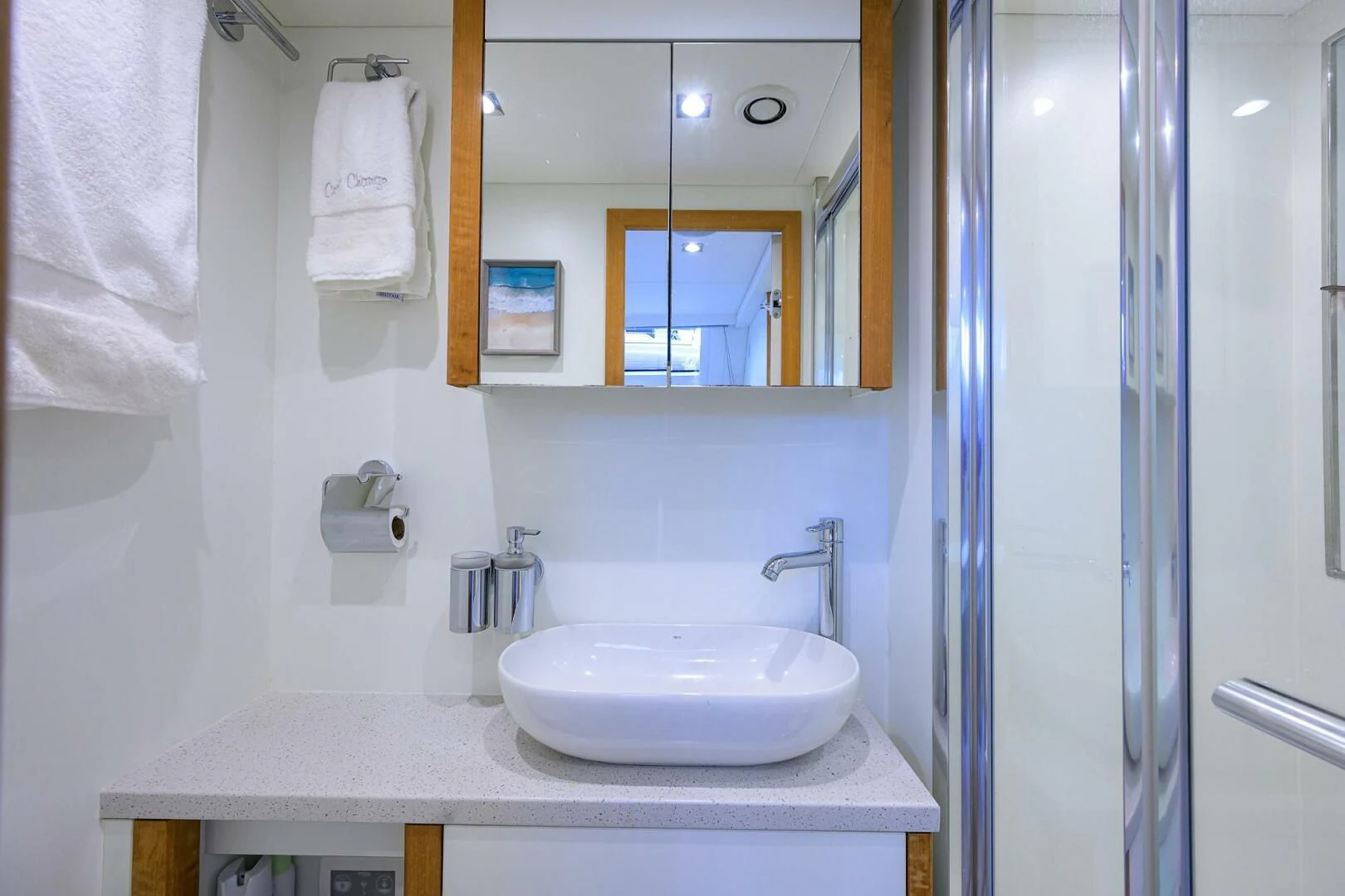 a bathroom with a sink and mirror aboard SKYCHASER Yacht for Sale