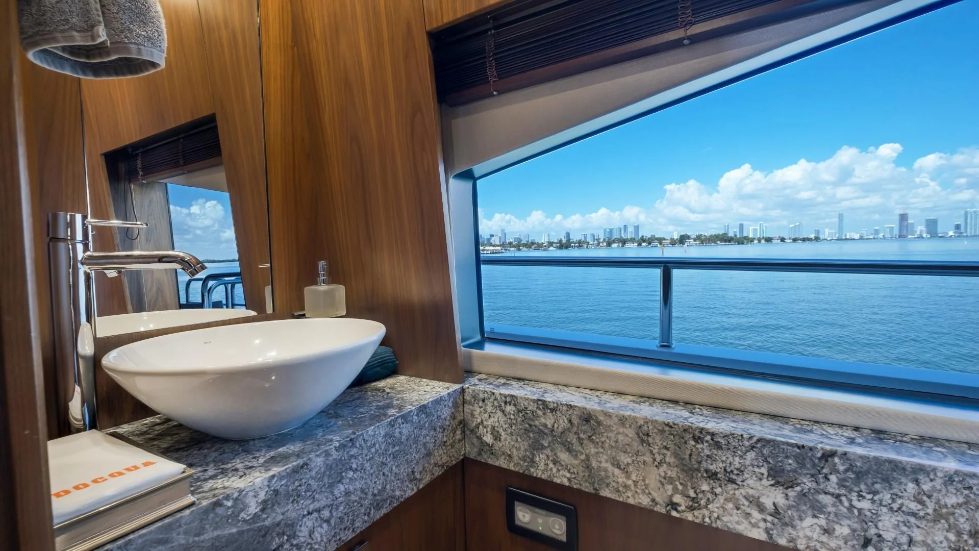 a bathroom with a large window aboard SKYCHASER Yacht for Sale