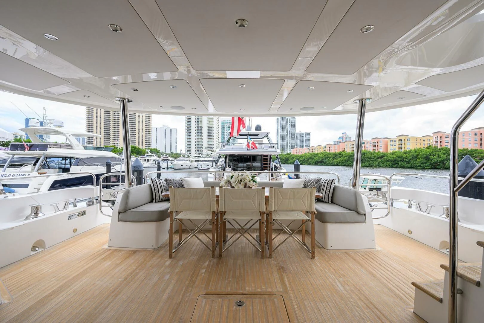a room with a table chairs and a large window aboard SKYCHASER Yacht for Sale