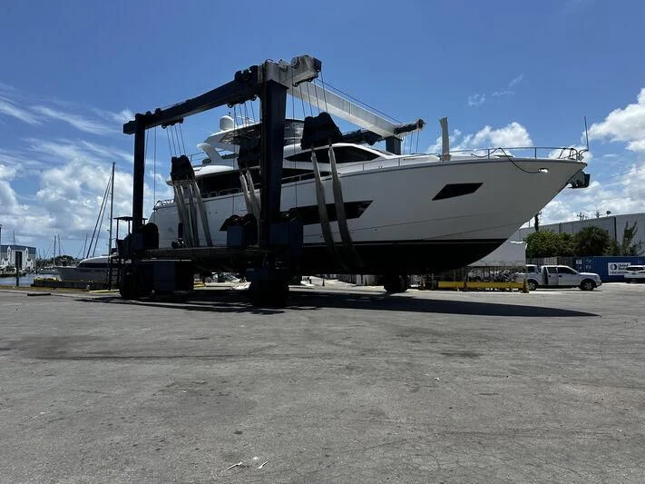 a large white boat on a trailer aboard SKYCHASER Yacht for Sale