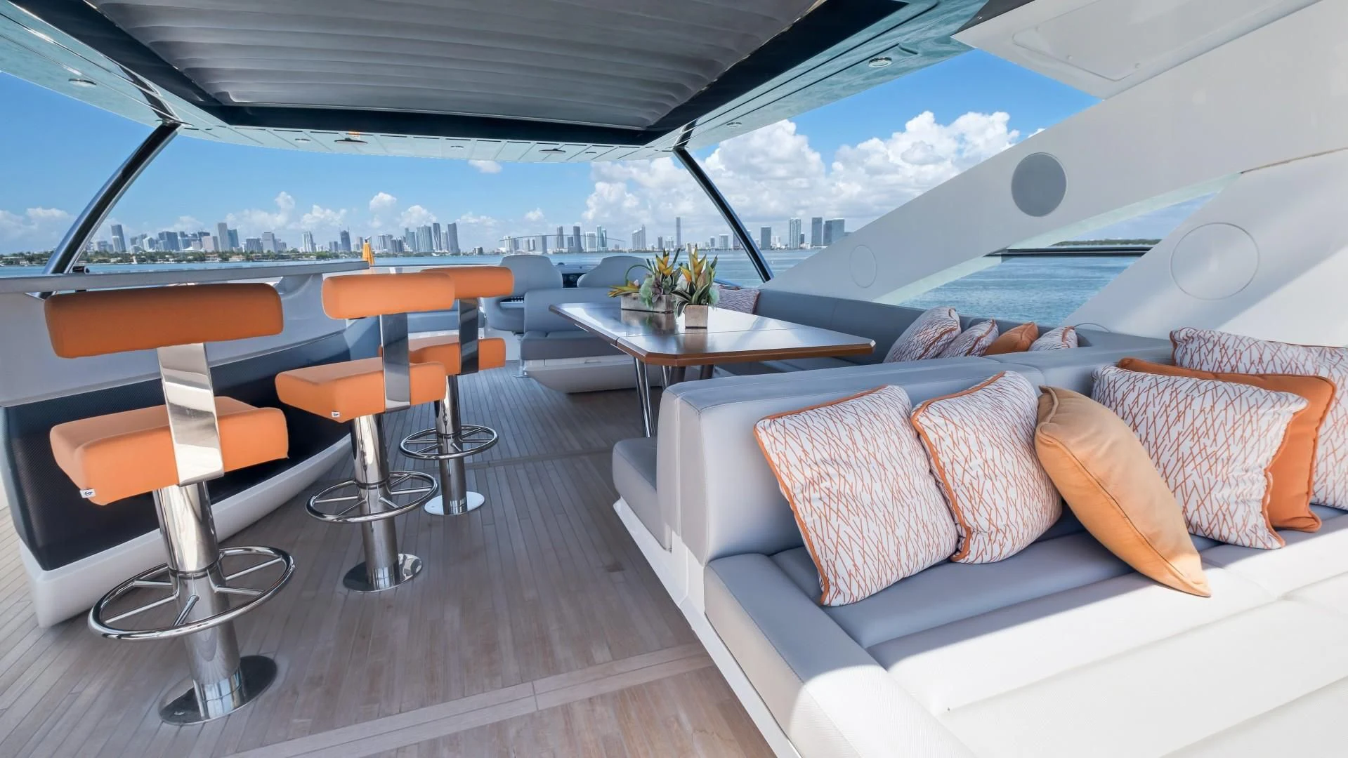 a room with a couch and a table and chairs aboard SKYCHASER Yacht for Sale