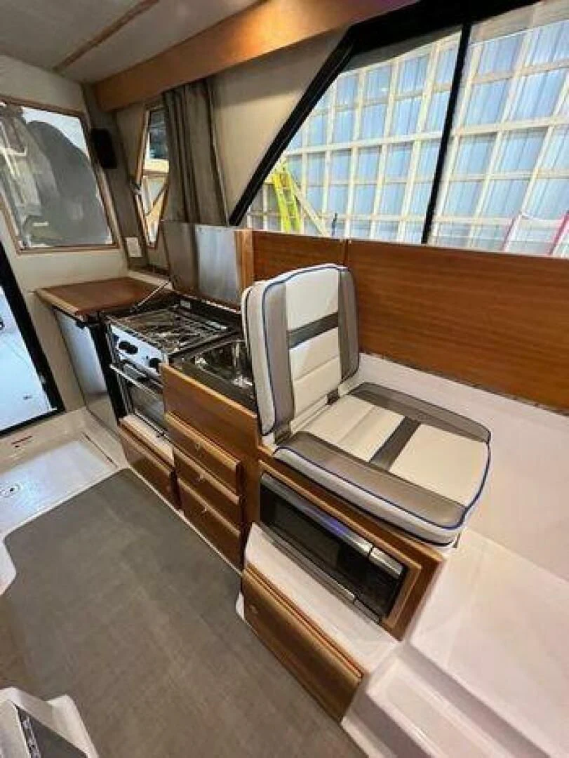 a kitchen with a stove and oven aboard SKYCHASER Yacht for Sale