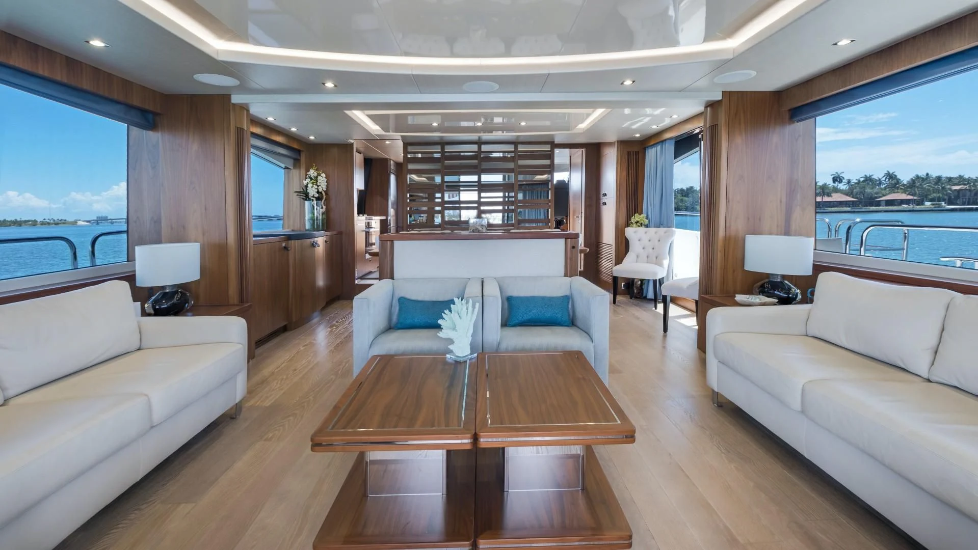 a living room with a couch and a table aboard SKYCHASER Yacht for Sale