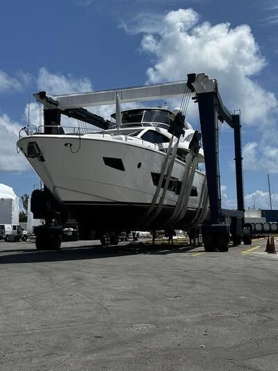 a large white boat on a trailer aboard SKYCHASER Yacht for Sale