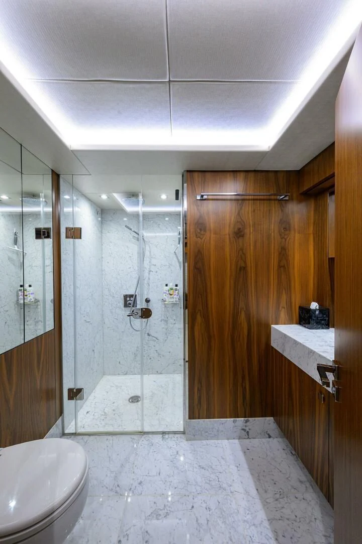 a bathroom with a shower aboard SKYCHASER Yacht for Sale