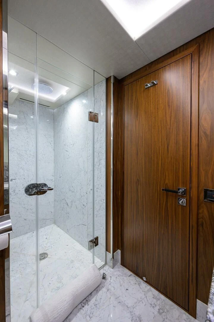 a bathroom with a shower aboard SKYCHASER Yacht for Sale