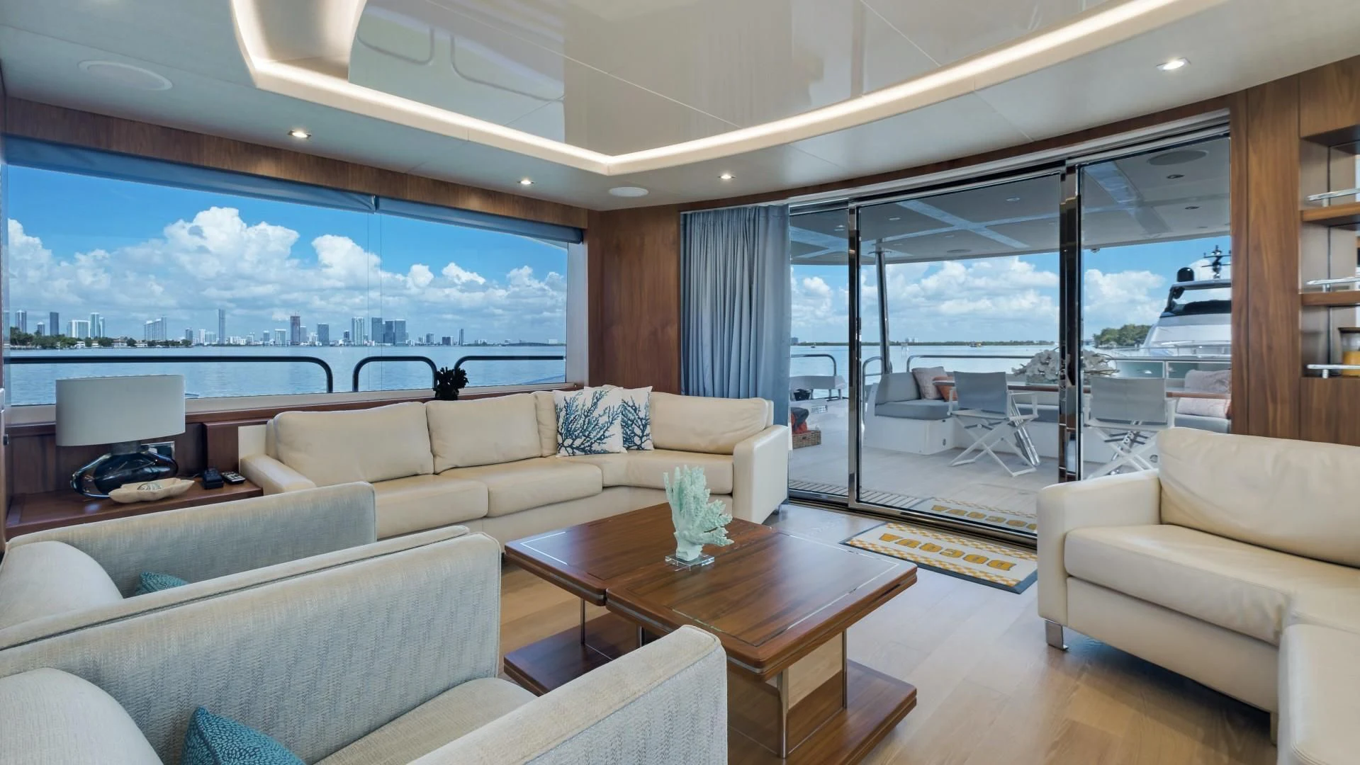 a living room with a large window aboard SKYCHASER Yacht for Sale