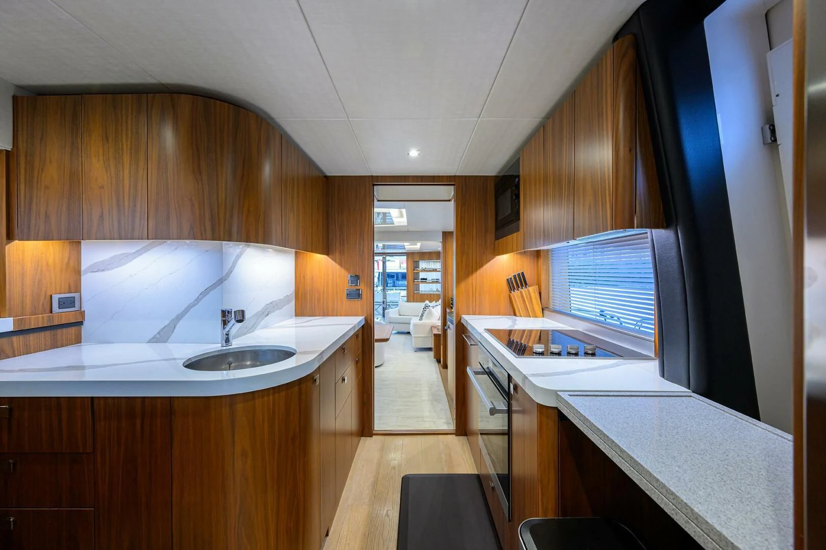a kitchen with wooden cabinets aboard SKYCHASER Yacht for Sale