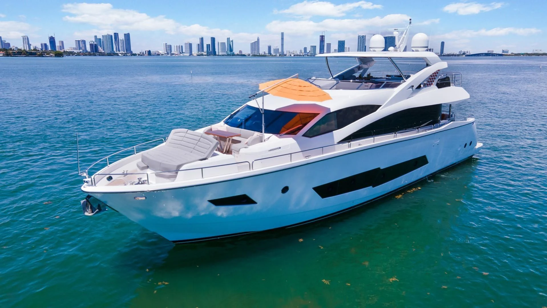 a white yacht in the water aboard SKYCHASER Yacht for Sale