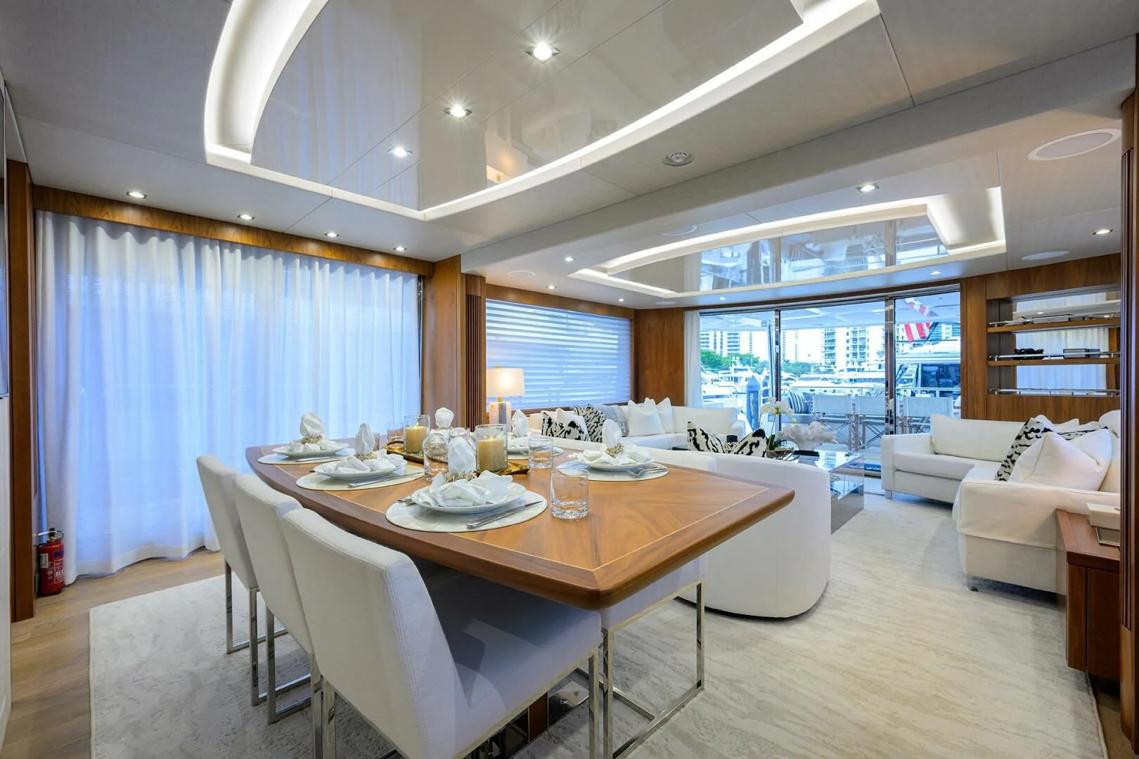 a large dining table in a living room aboard SKYCHASER Yacht for Sale