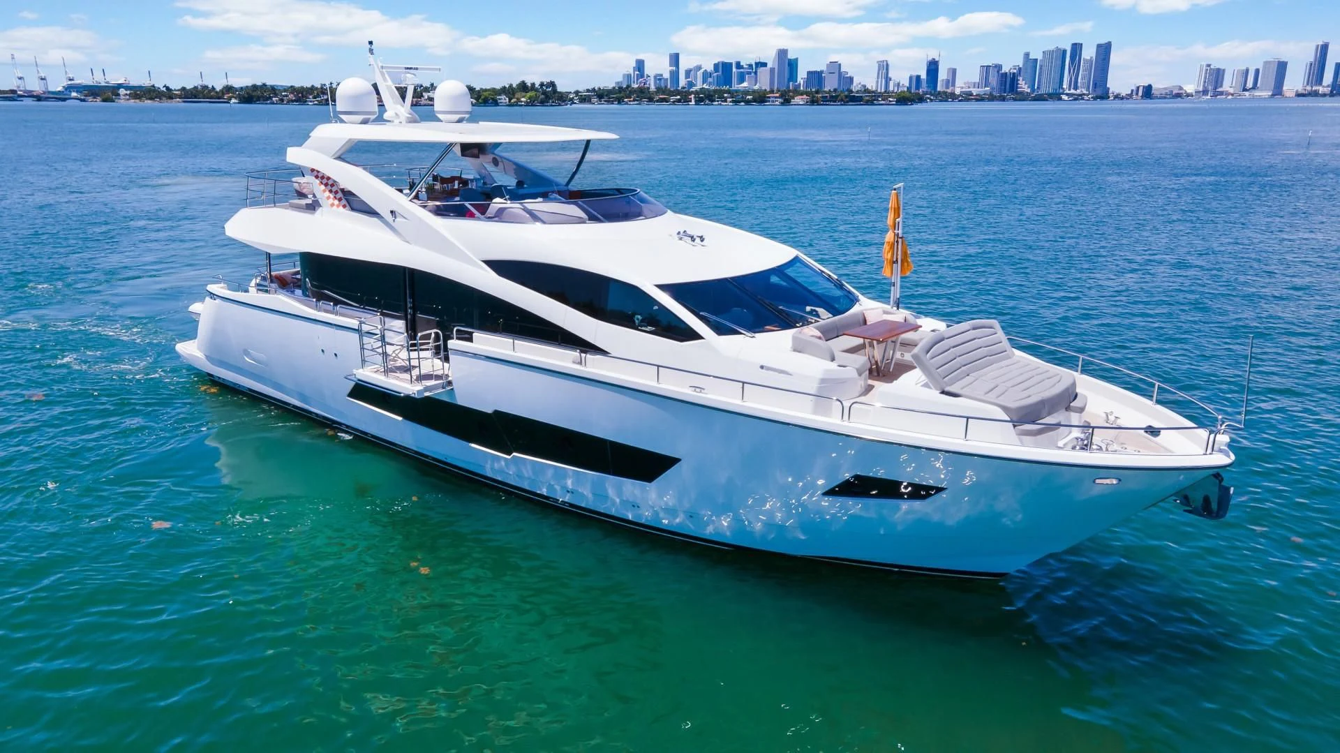 a white yacht on the water aboard SKYCHASER Yacht for Sale