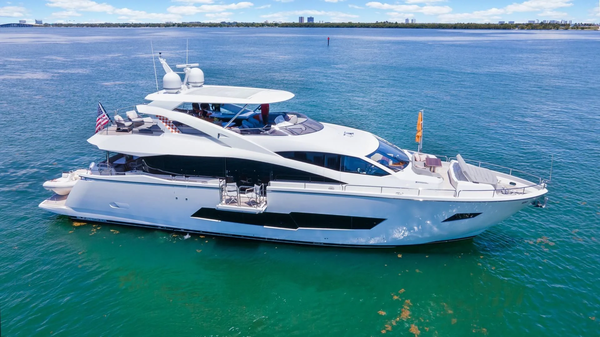 a white yacht in the water aboard SKYCHASER Yacht for Sale