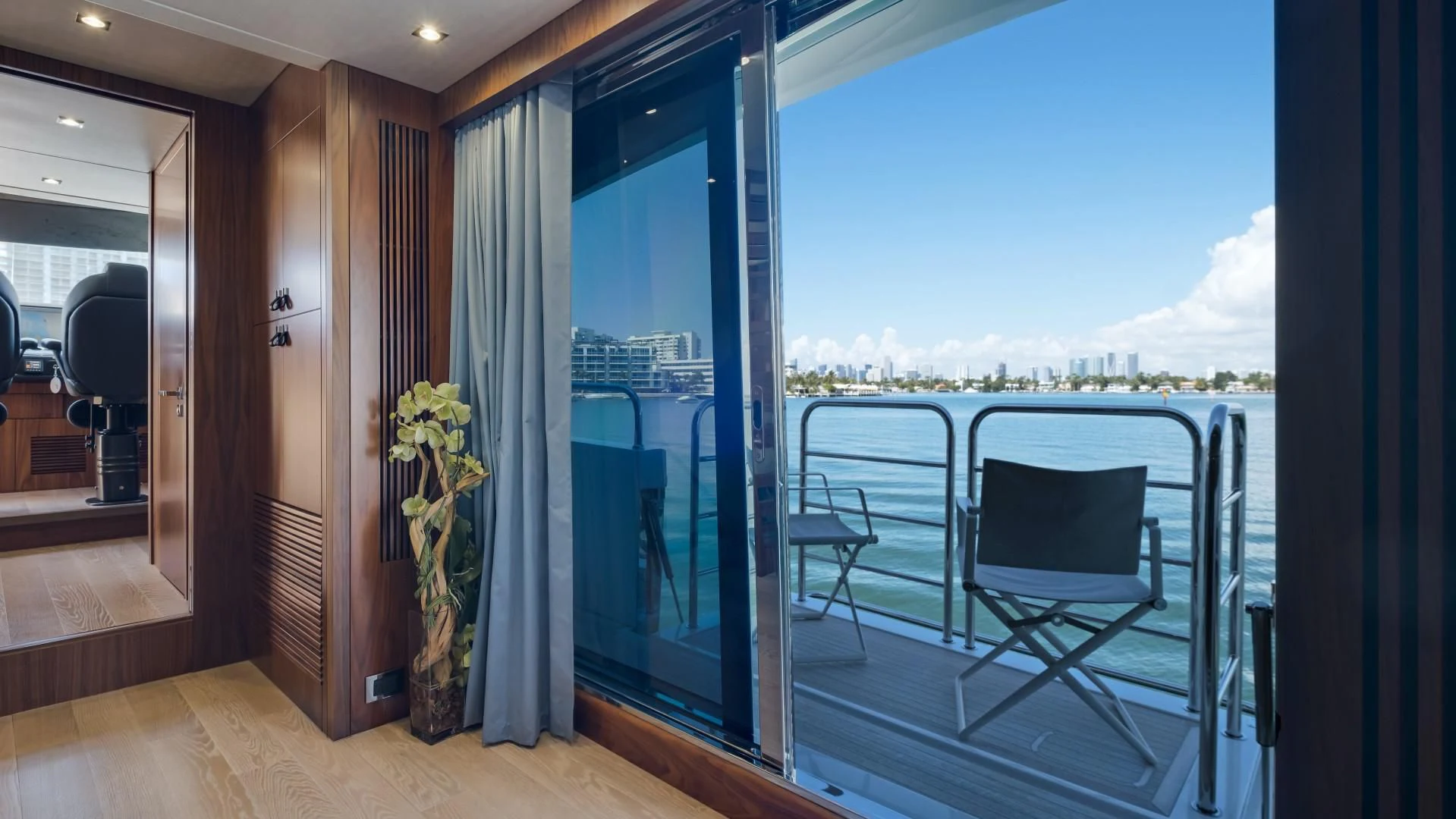 a balcony with a view of the city aboard SKYCHASER Yacht for Sale