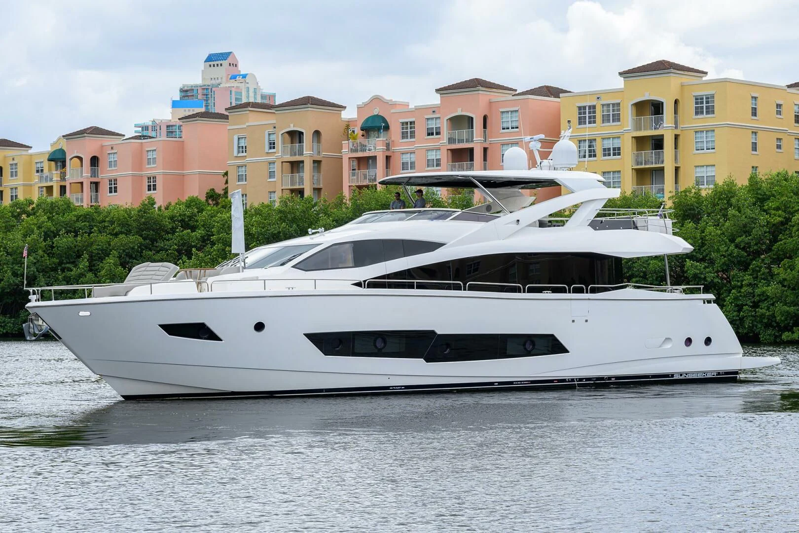 a white yacht on the water aboard SKYCHASER Yacht for Sale