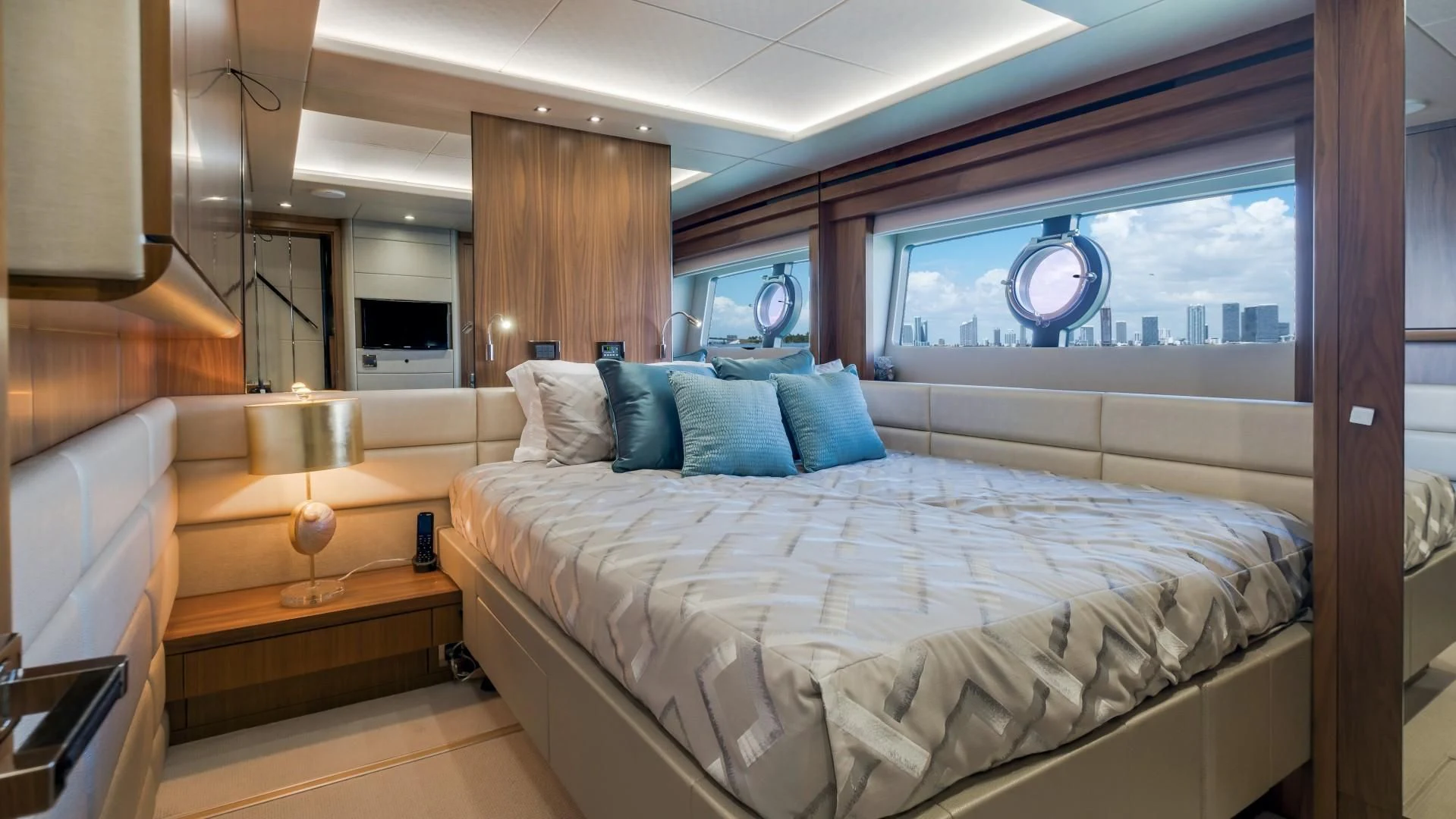 a room with a bed and a window aboard SKYCHASER Yacht for Sale