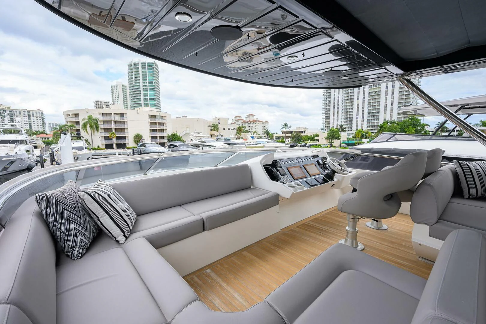 a room with couches and a view of a city aboard SKYCHASER Yacht for Sale