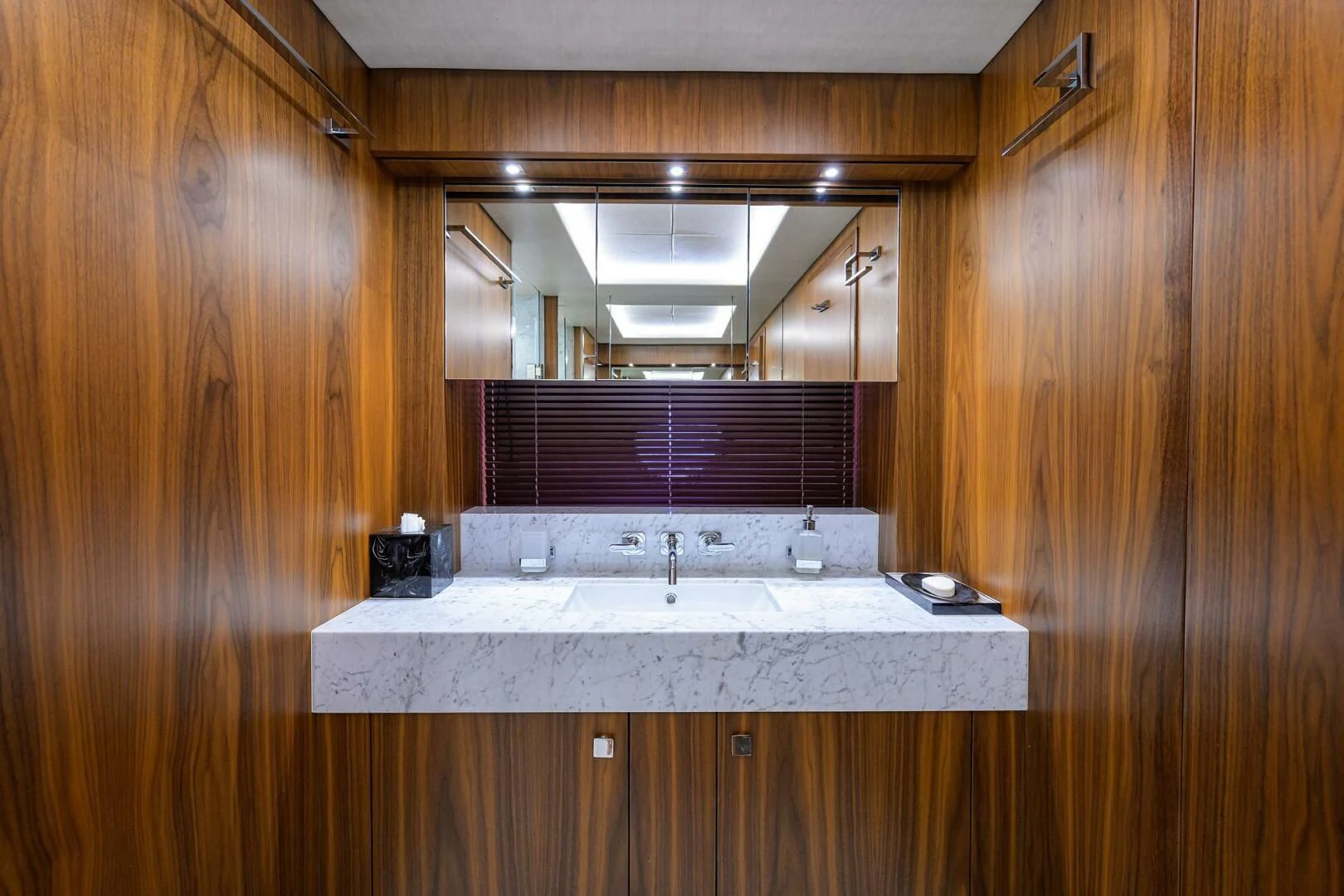 a kitchen with a sink and a mirror aboard SKYCHASER Yacht for Sale