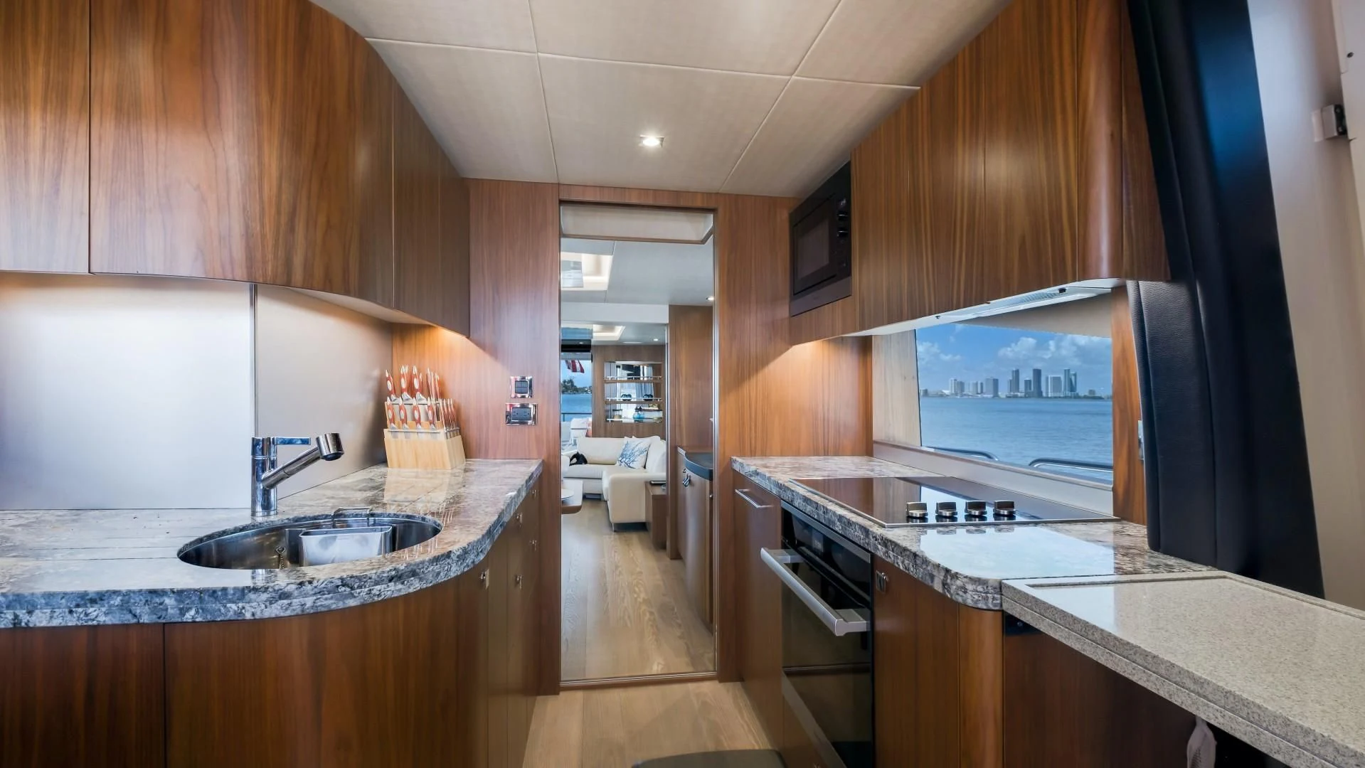 a kitchen with a sink and stove aboard SKYCHASER Yacht for Sale