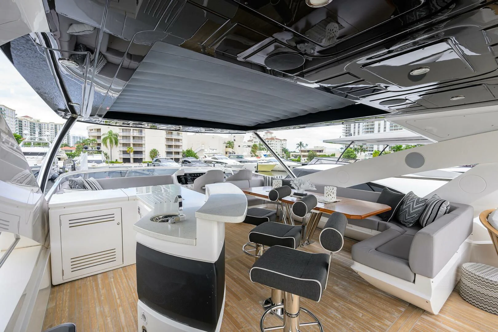 a room with a table and chairs aboard SKYCHASER Yacht for Sale