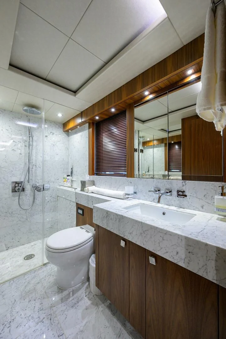 a bathroom with a sink and toilet aboard SKYCHASER Yacht for Sale