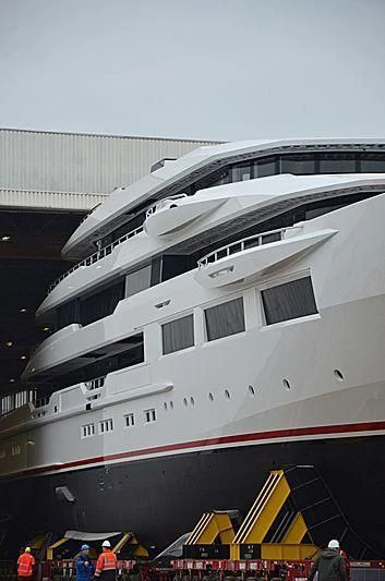 a large white boat with a red stripe aboard SHODAN Yacht for Sale