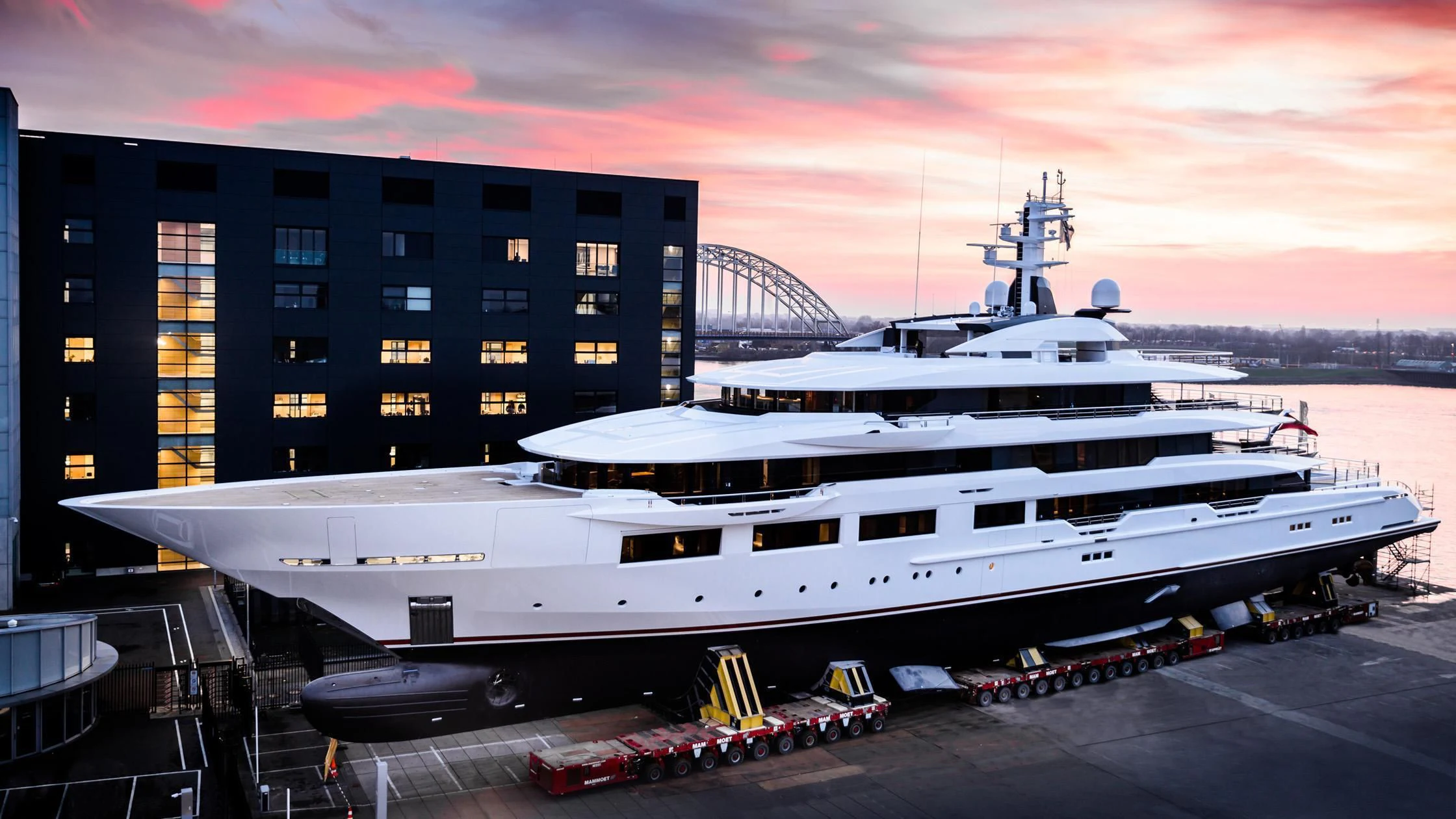 a large ship docked at a port aboard SHODAN Yacht for Sale