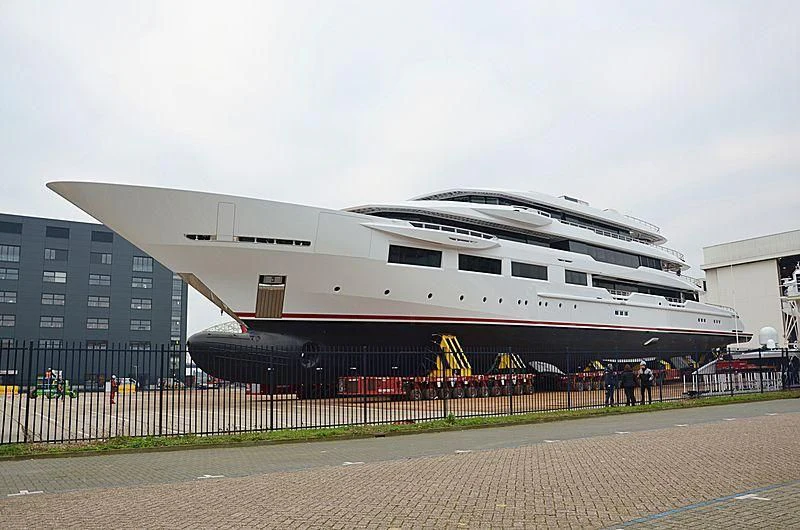 a large cruise ship docked aboard SHODAN Yacht for Sale
