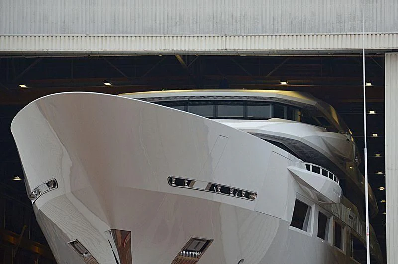a white airplane in a building aboard SHODAN Yacht for Sale