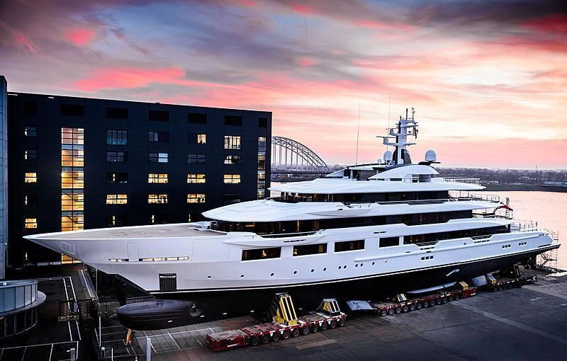 a large white ship docked at a dock aboard SHODAN Yacht for Sale