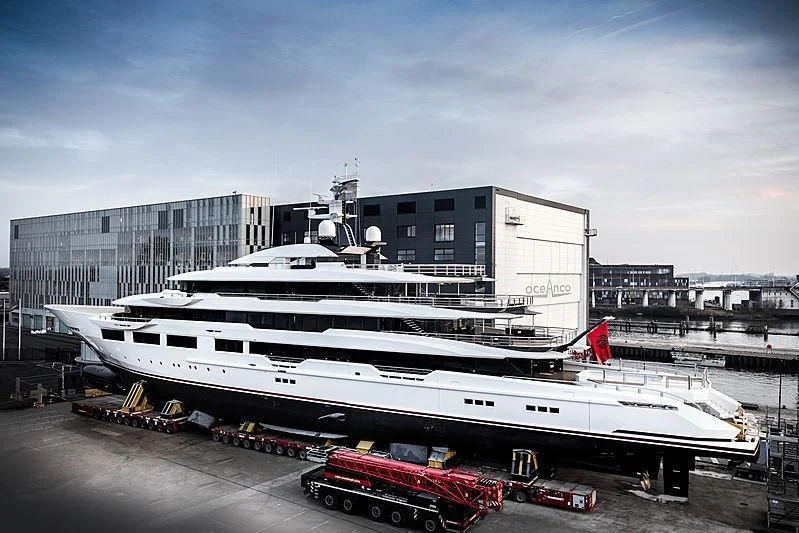 a large white boat sits in a dock aboard SHODAN Yacht for Sale