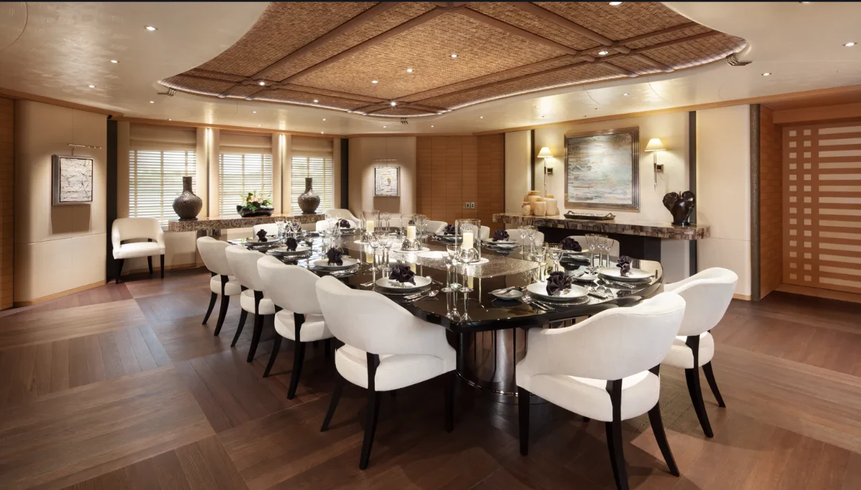a large dining room with tables and chairs aboard SHODAN Yacht for Sale